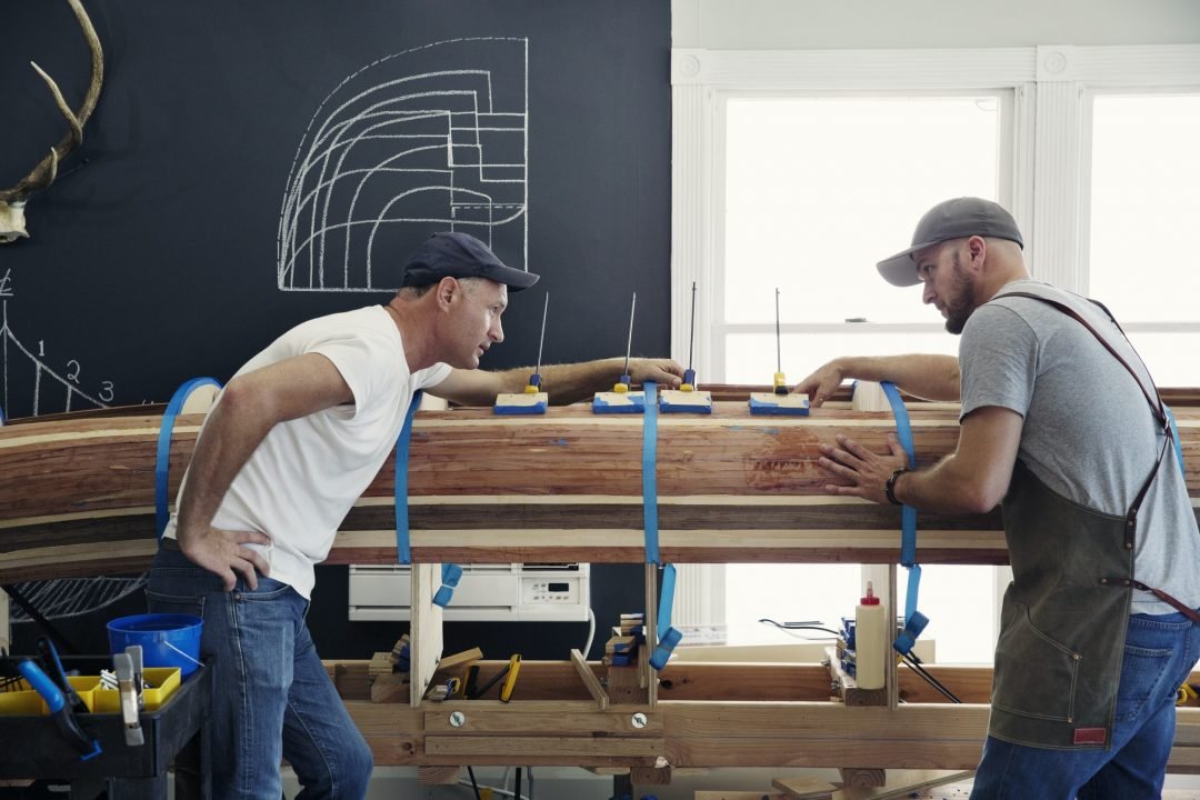 Carpenters Working On Canoe